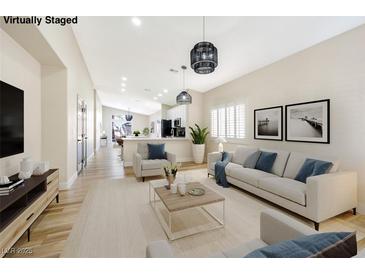 Bright living room featuring modern light fixtures and stylish furniture at 4900 Cascade Pools Ave, Las Vegas, NV 89131