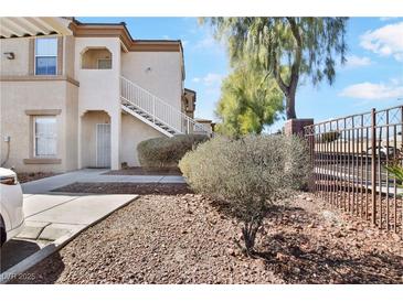 Attractive condo building exterior with well-maintained landscaping and convenient stair access at 3400 Cabana Dr # 2103, Las Vegas, NV 89122