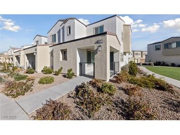 Charming two-story townhouse with drought-resistant landscaping and modern architectural details at 3541 Arcadian Sea St, Las Vegas, NV 89106