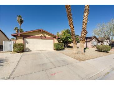 Charming single-story home featuring a well-maintained front yard and an attached two-car garage at 1349 Foxglove Dr, Las Vegas, NV 89142