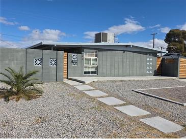 Charming single-story home featuring xeriscape, custom block fence, and unique modern exterior design at 1642 Palma Vista Ave, Las Vegas, NV 89169