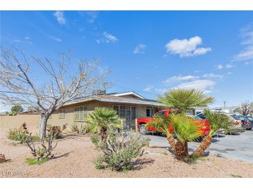 Charming single-story home featuring desert landscaping and a spacious driveway at 4305 Puebla St, Las Vegas, NV 89115