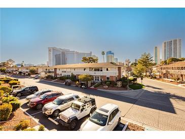 Attractive building with mature landscaping, parking, and proximity to nearby businesses at 737 Oakmont Ave # 1202, Las Vegas, NV 89109