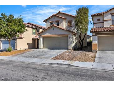 Charming two-story home featuring a tile roof and a spacious two-car garage at 9526 Vast Valley Ave, Las Vegas, NV 89148