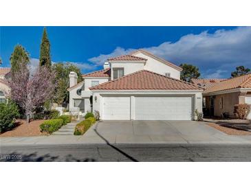 Charming two-story home featuring a red tile roof and a spacious two-car garage at 2864 Cape Verde Ln, Las Vegas, NV 89128