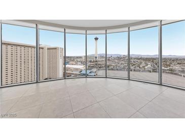 Bright living room with floor-to-ceiling windows offering panoramic city views at 222 Karen Ave # 1908, Las Vegas, NV 89109