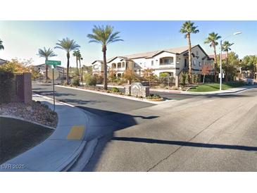 Beautiful Calesa at Mountains Edge community featuring Spanish-style architecture and lush landscaping at 2291 W Horizon Ridge Pkwy # 2208, Henderson, NV 89052
