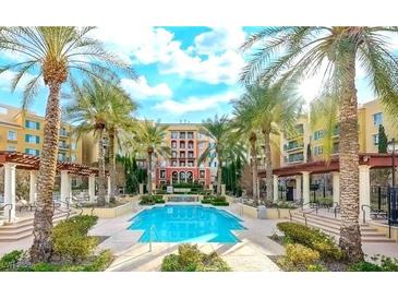Resort style pool with surrounding palms, covered seating areas and luxurious condos at 30 Strada Di Villaggio # 118, Henderson, NV 89011