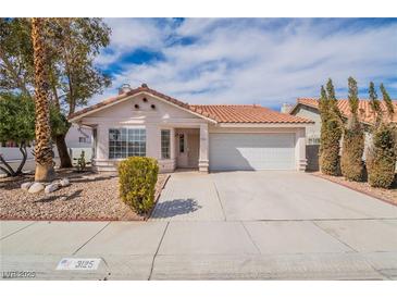 Charming single-story home featuring a terracotta tile roof and a well-manicured front yard at 3125 Cristobal Way, Las Vegas, NV 89117