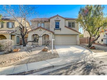 Charming two-story home with well-kept front yard landscaping and a two car garage at 4225 Ponce Royal Ave, North Las Vegas, NV 89031