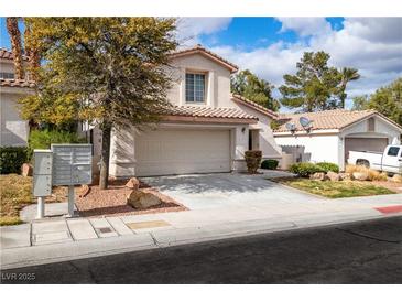 Charming home featuring a two-car garage and well-maintained landscaping at 8112 Broken Spur Ln, Las Vegas, NV 89131