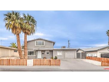 Charming two-story home with a freshly sealed driveway, desert landscaping, and curb appeal at 1812 Renada Cir, North Las Vegas, NV 89030