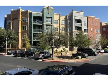 Beautiful exterior view of a modern condo complex featuring colorful architecture at 26 E Serene Ave # 412, Las Vegas, NV 89123