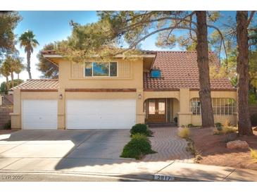 Charming two-story home featuring a well-manicured yard and a two car garage at 2917 Chapala Dr, Las Vegas, NV 89120