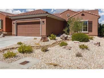 Charming single story home with low maintenance desert landscaping and a two car garage at 1407 Wheelwright Ct, Mesquite, NV 89034