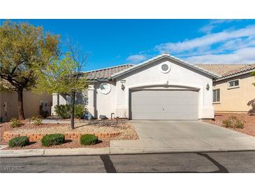 Charming single-story home with a two-car garage and well-maintained landscaping at 3215 Stratford Hall Ct, Las Vegas, NV 89135