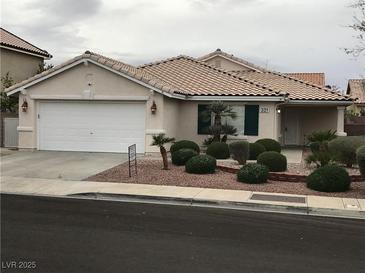 Charming single-story home with desert landscaping, two-car garage, and a well-maintained front yard at 331 Mount Hope St, Henderson, NV 89014