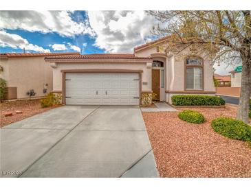Charming single-story home with a two-car garage and a well-maintained front yard landscape at 3441 Mountain Park St, Las Vegas, NV 89129