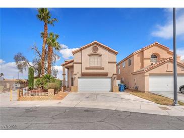 Charming two-story home featuring a two-car garage, landscaped front yard, and stucco exterior at 3536 Golden Pedal St, Las Vegas, NV 89129