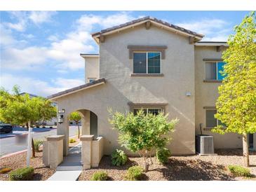 Charming two-story home featuring a covered entryway and low maintenance landscaping at 760 Crisp Morning Ct, North Las Vegas, NV 89086