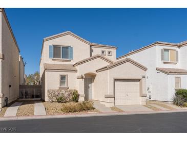 Charming two-story home with a one car garage and desert landscaping at 9935 Swimming Hole St, Las Vegas, NV 89183