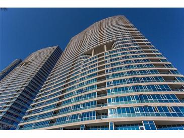 Stunning high-rise building featuring modern architecture with reflective glass windows against a vibrant blue sky at 4575 Dean Martin Dr # 3007, Las Vegas, NV 89103