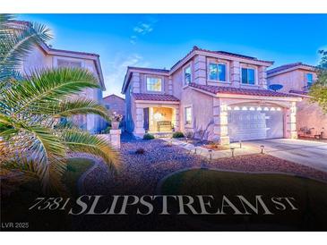 Charming two-story home with a two-car garage and well-manicured front yard at 7581 Slipstream St, Las Vegas, NV 89139