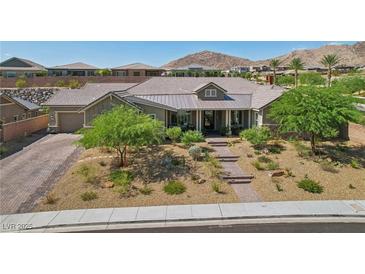 Charming single-story home with desert landscaping and mountain views in the background at 11181 Luna Blanca Dr, Las Vegas, NV 89138