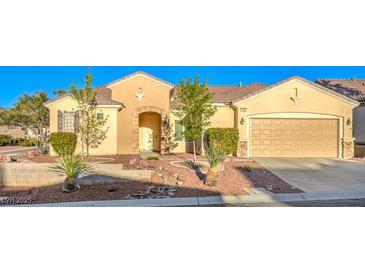 Beautiful single-story home with a desert landscape and attached two car garage at 2186 Savannah River St, Henderson, NV 89044
