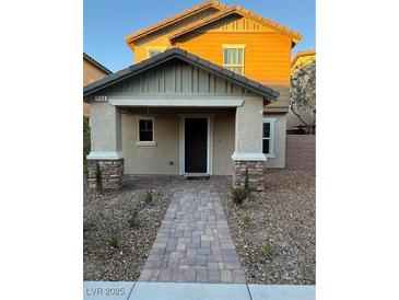 Charming home featuring a welcoming front porch and a paved walkway leading to the entrance at 3160 Del Dotto Walk, Henderson, NV 89044