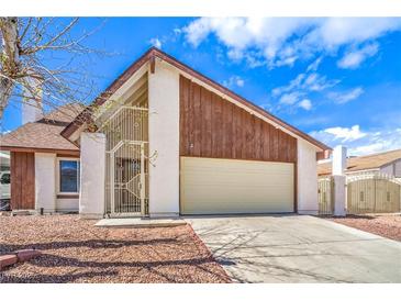 Charming home showcasing a two-car garage, and a gated front entrance, complemented by a well-maintained landscape at 3963 Redwood St, Las Vegas, NV 89103