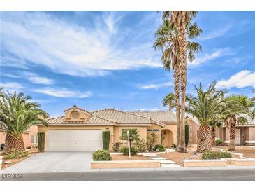 Charming single-story home featuring desert landscaping, a two-car garage, and an inviting entryway with desert landscaping at 7613 Falconwing Ave, Las Vegas, NV 89131