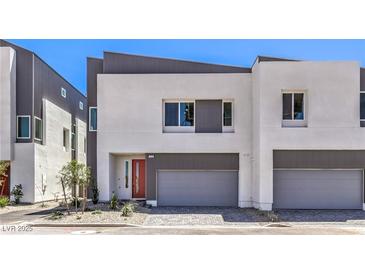 Modern two-story home boasts a neutral palette and sleek design with a two-car garage at 8629 Ensworth St # 112, Las Vegas, NV 89123