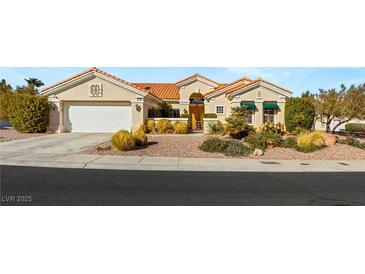 Charming single-story home featuring a tile roof, well-manicured landscaping, and inviting curb appeal at 10548 Findlay Ave, Las Vegas, NV 89134