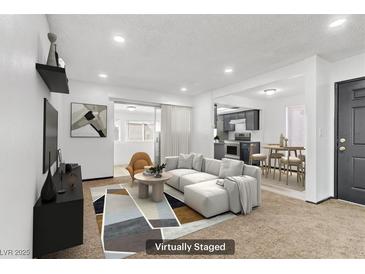 Bright living room featuring a modern sectional, stylish decor, and lots of natural light at 1390 Vegas Valley Dr # 32, Las Vegas, NV 89169