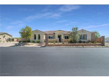 Charming single-story home with manicured front yard and desert landscaping at 5812 Shangri La Night Ct, Las Vegas, NV 89149