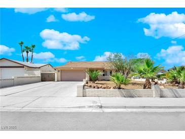 Charming single story home with desert landscaping and a spacious driveway at 2302 Wagonwheel Ave, Las Vegas, NV 89119