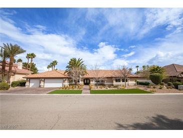 Charming single-story home with a well-manicured front yard and a two-car garage at 3236 Cliff Sieler Ct, Las Vegas, NV 89117