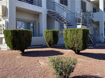 Exterior shot with attractive, manicured landscaping near building access stairs at 3318 N Decatur Blvd # 1056, Las Vegas, NV 89130