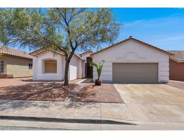Charming single-story home featuring a two-car garage and low-maintenance desert landscaping at 531 Coolidge Ave, Henderson, NV 89015