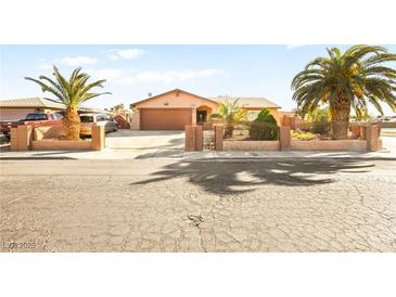 Charming single-story home featuring desert landscaping and a two-car garage at 5717 Christchurch Ave, Las Vegas, NV 89110