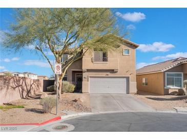 Inviting two-story home featuring a two-car garage, landscaped front yard, and neutral stucco exterior at 6552 Casamar St, North Las Vegas, NV 89086