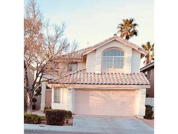 Charming two-story home featuring a tile roof, stucco siding, and attached two-car garage at 9008 Cotton Rose Way, Las Vegas, NV 89134