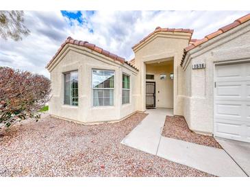 Charming single-story home showcasing a well-maintained front yard and inviting entrance at 1516 Dusty Canyon St, Henderson, NV 89052
