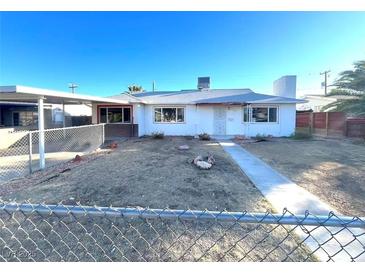Single-story home featuring a simple architectural style and a front yard at 2208 E Ogden Ave, Las Vegas, NV 89101