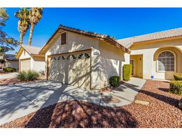 Charming home featuring a well-maintained exterior and a two-car garage at 5448 Cove Point Dr, Las Vegas, NV 89130