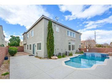 Backyard view featuring a pool and spa with patio area, perfect for relaxing or entertaining outdoors at 9003 Greek Palace Ave, Las Vegas, NV 89178