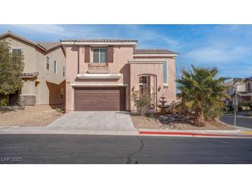 Charming two-story home with a landscaped front yard and attached two-car garage at 10478 Beallsville St, Las Vegas, NV 89141