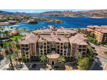 Beautiful lakefront condos with tile roofs, palm trees, and stunning mountain and water views at 15 Via Mantova # 308, Henderson, NV 89011