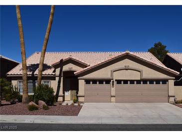 Charming single-story home with well-maintained desert landscaping and a two-car garage at 2744 Pala Dura Dr, Henderson, NV 89074